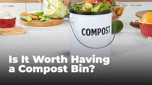 Saratoga Home's White Compost Bin filled with composts in front of a spread of vegetables