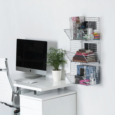 Assembled 3-tier wire storage bins hanged beside a bedroom computer desktpop